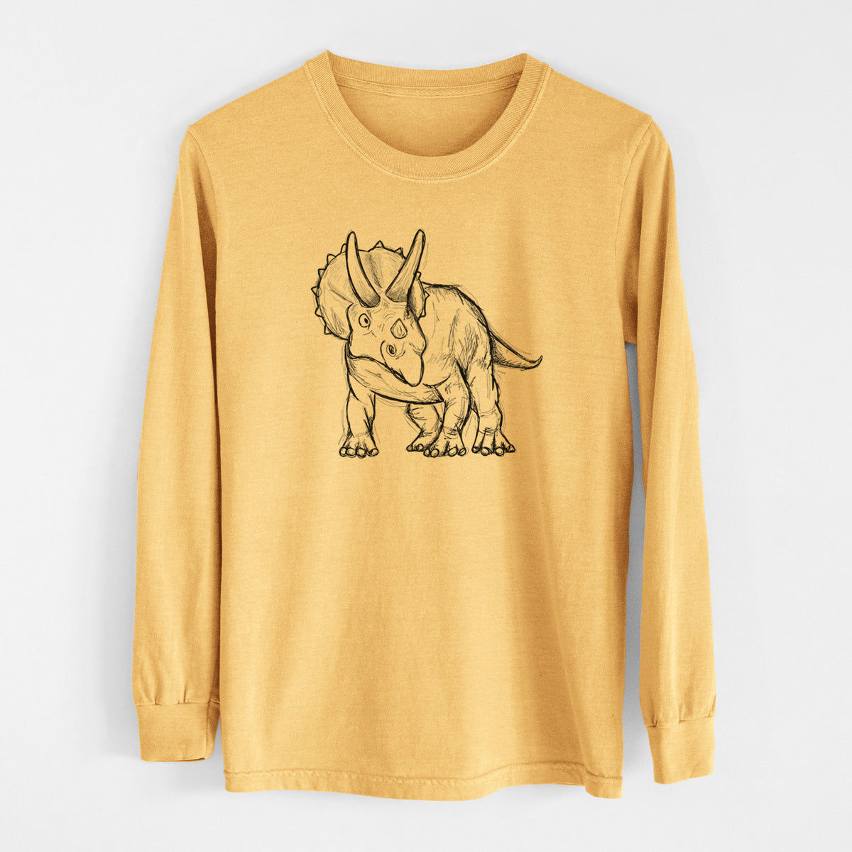 Golden wheat yellow Comfort Colors long sleeve shirt laid flat, printed with a black ink illustration of a Triceratops walking.