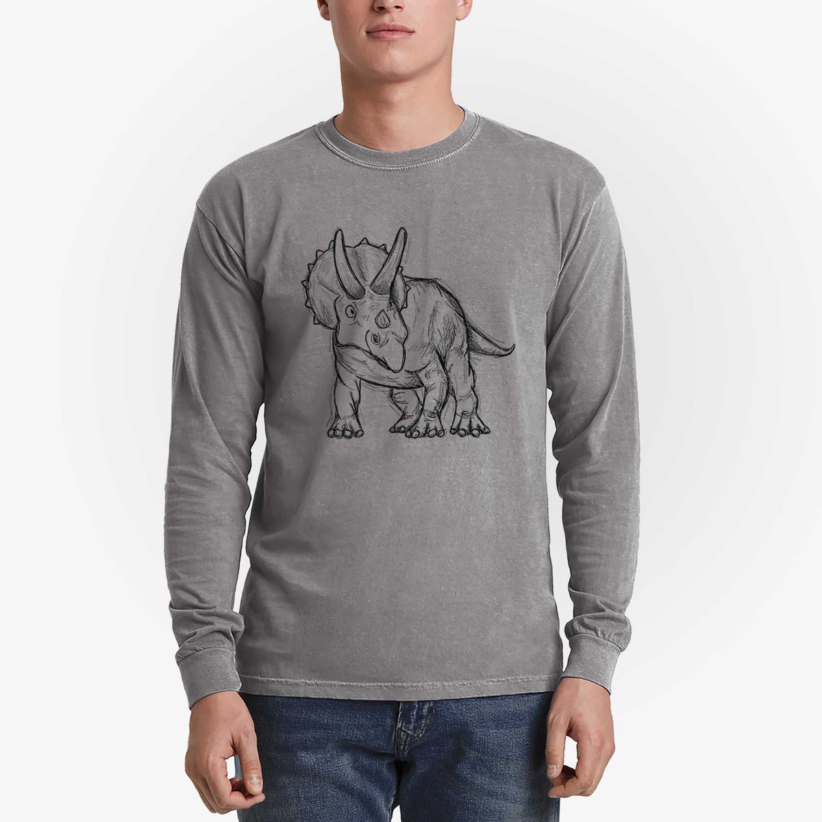 Man wearing a grey Comfort Colors long sleeve shirt printed with a black ink illustration of a Triceratops walking.