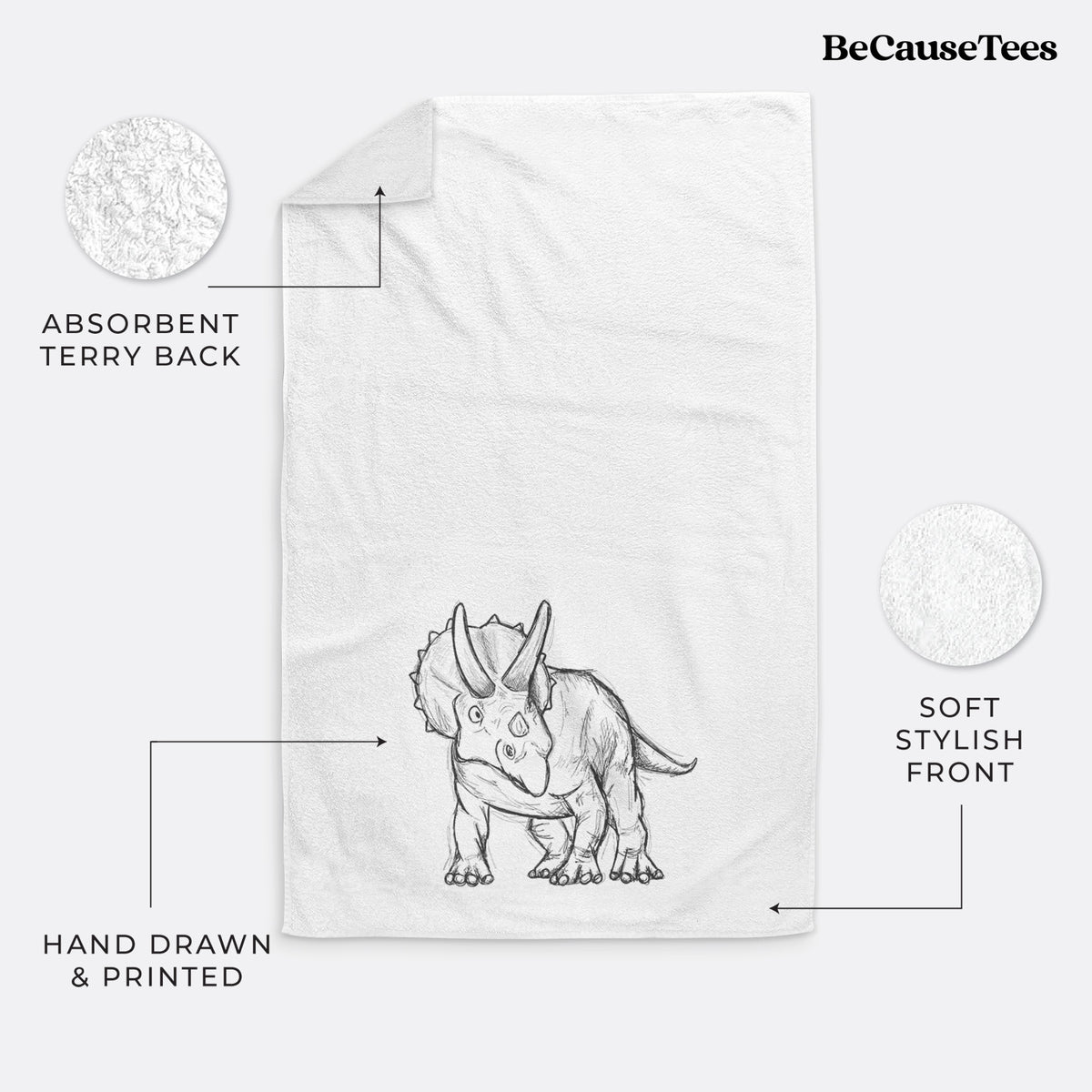 White hand towel printed with a black ink illustration of a Triceratops walking.
