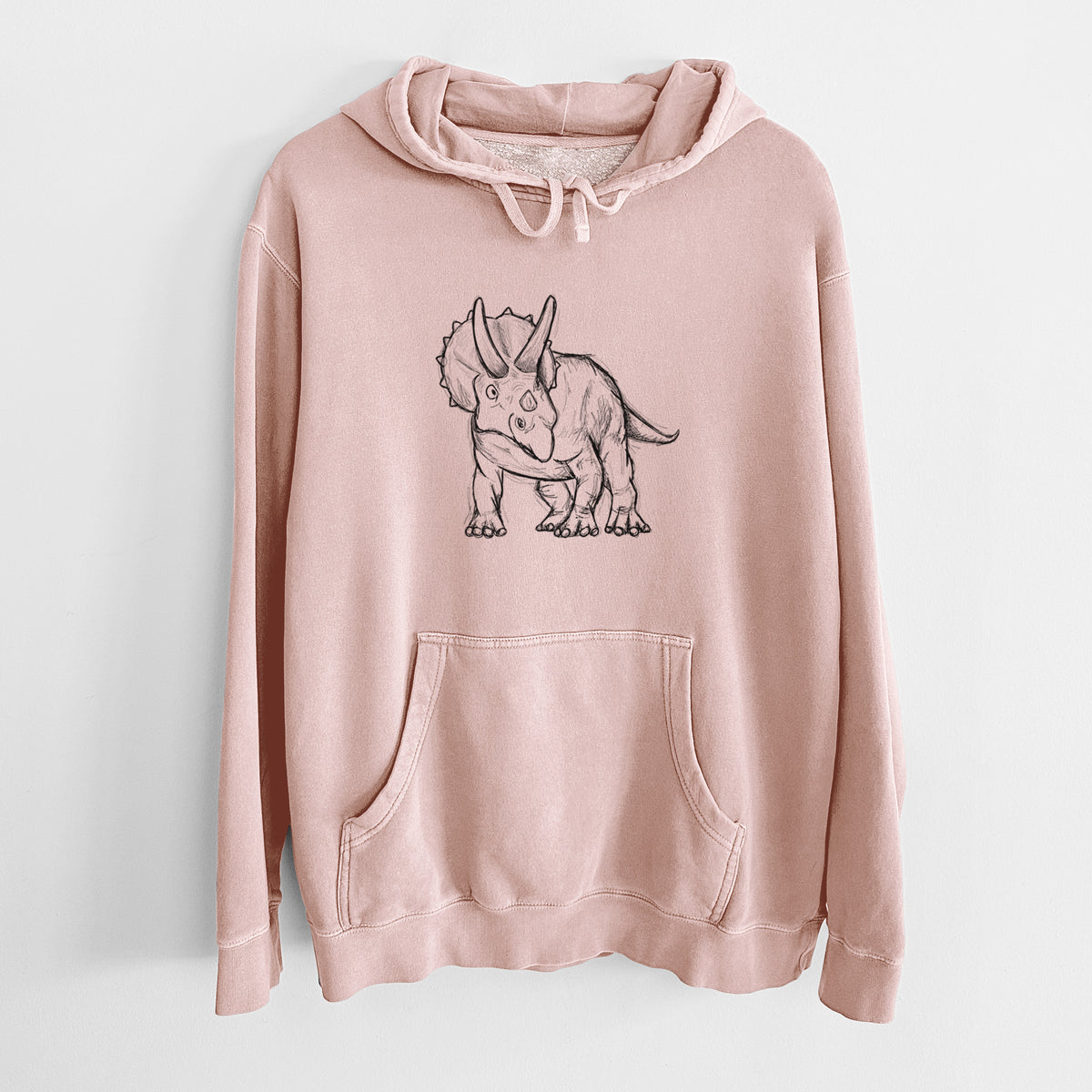 Dusty pink pigment dyed hoodie laid flat, printed with a black ink illustration of a Triceratops walking.