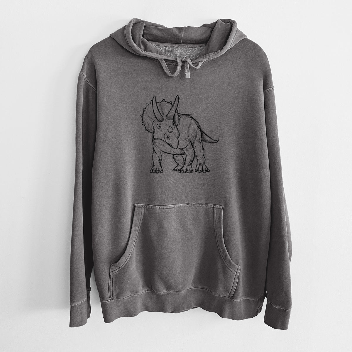 Faded black pigment dyed hoodie laid flat, printed with a black ink illustration of a Triceratops walking.