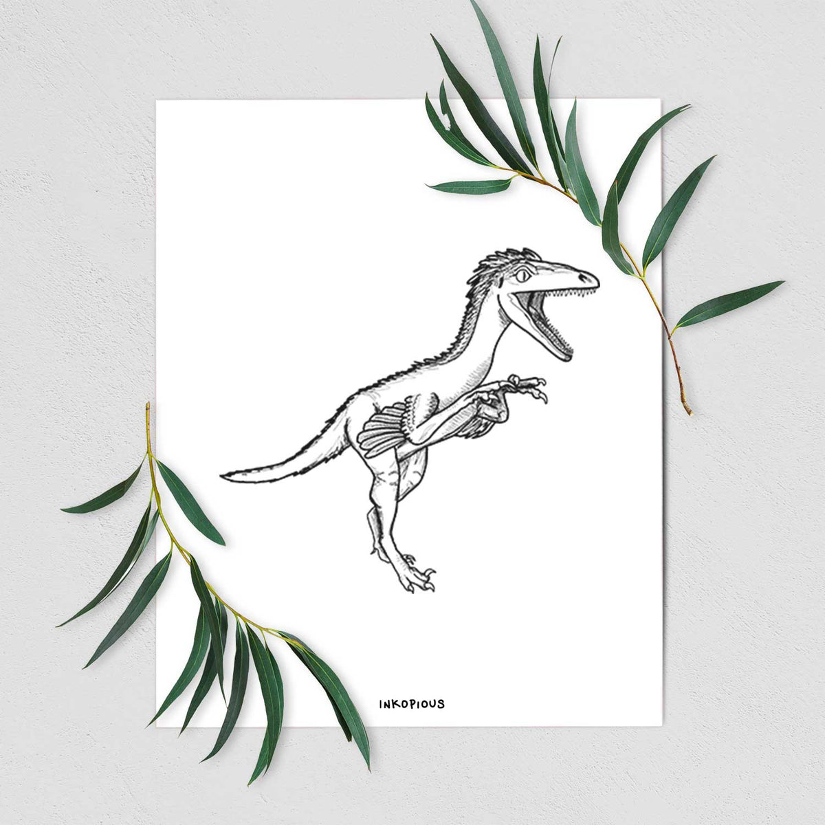 Art print of a black ink illustration of a Troodon dinosaur running, shown with eucalyptus leaves.