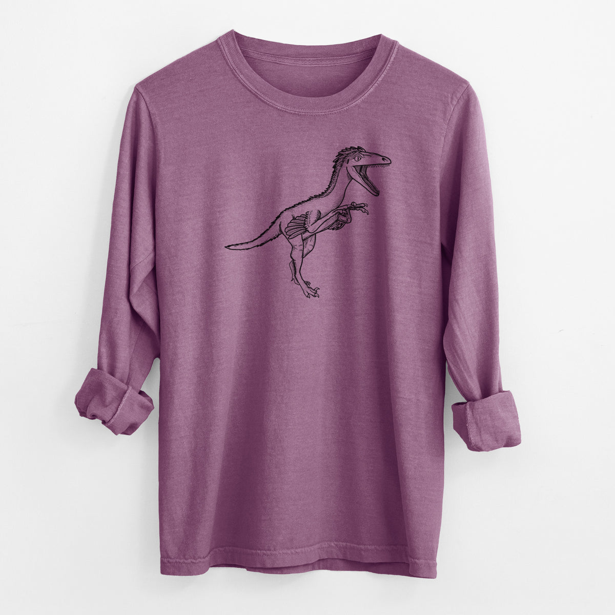 Berry pink Comfort Colors long sleeve shirt laid flat with the cuffs rolled, printed with a black ink illustration of a Troodon dinosaur running.