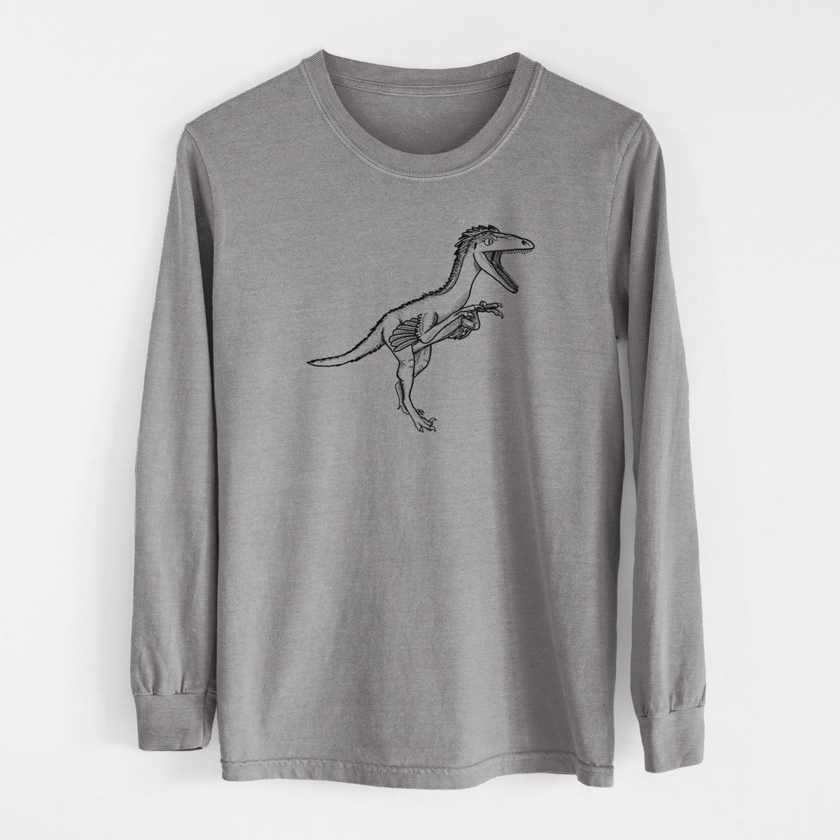 Grey Comfort Colors long sleeve shirt laid flat, printed with a black ink illustration of a Troodon dinosaur running.