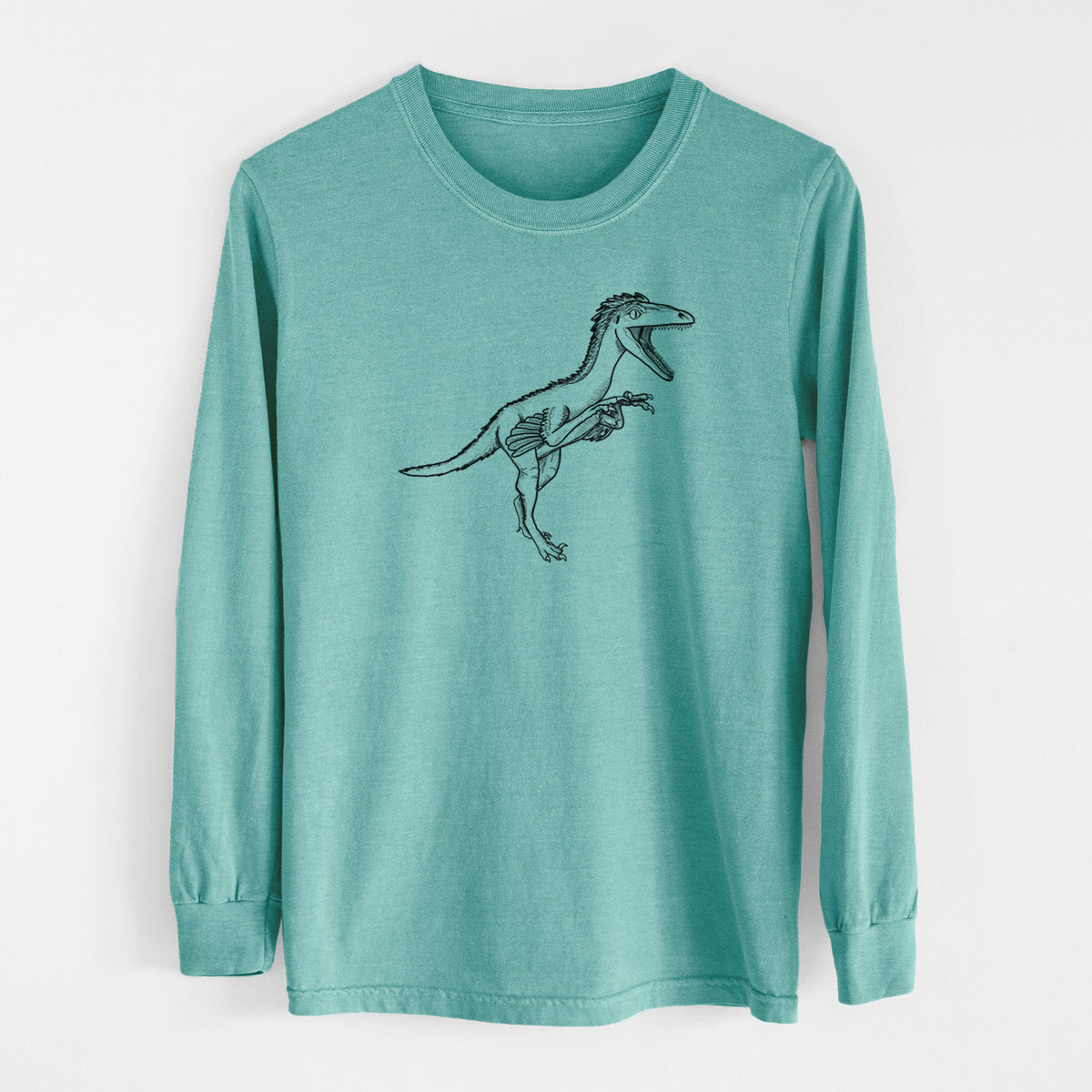 Reef green Comfort Colors long sleeve shirt laid flat, printed with a black ink illustration of a Troodon dinosaur running.