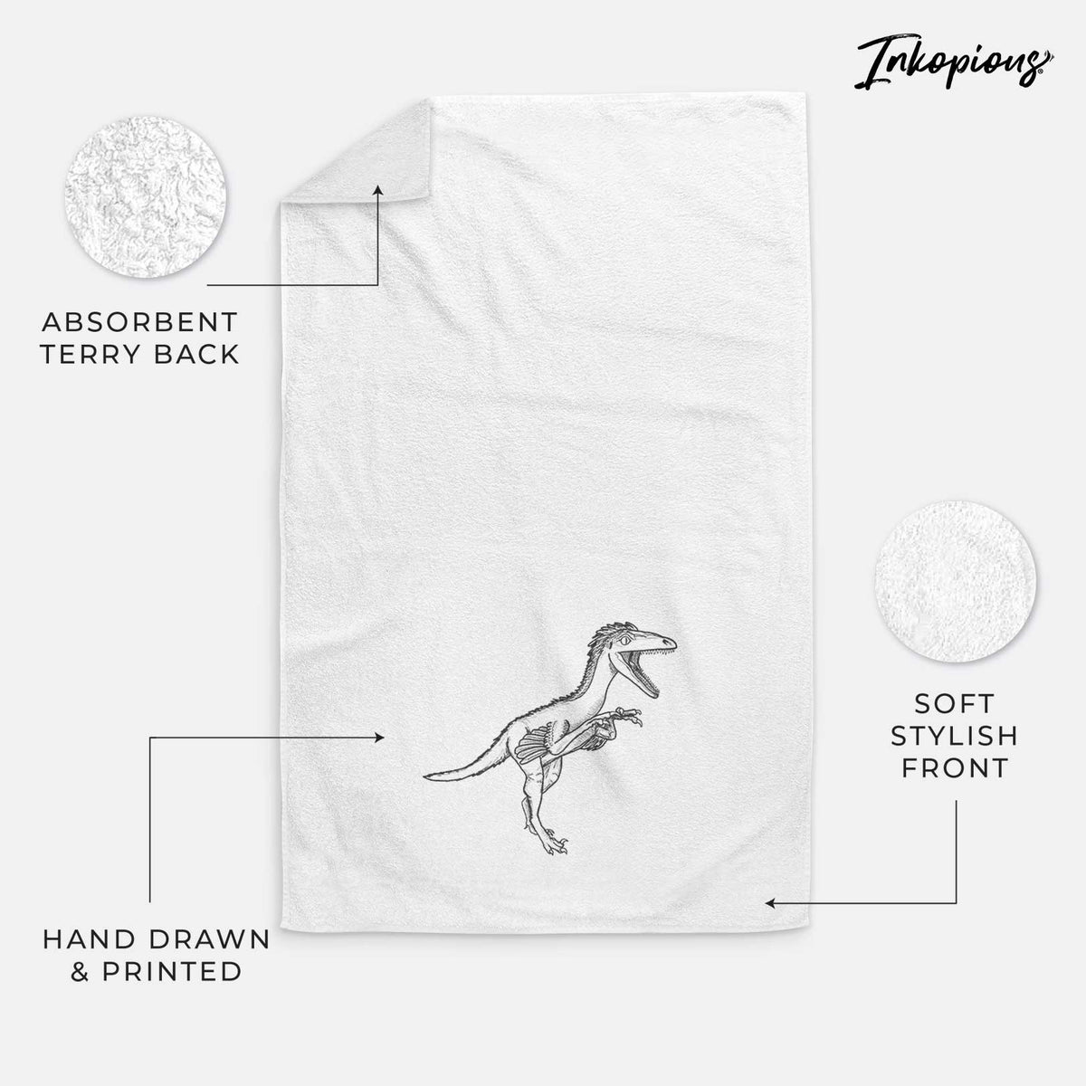 White hand towel printed with a black ink illustration of a Troodon dinosaur running.
