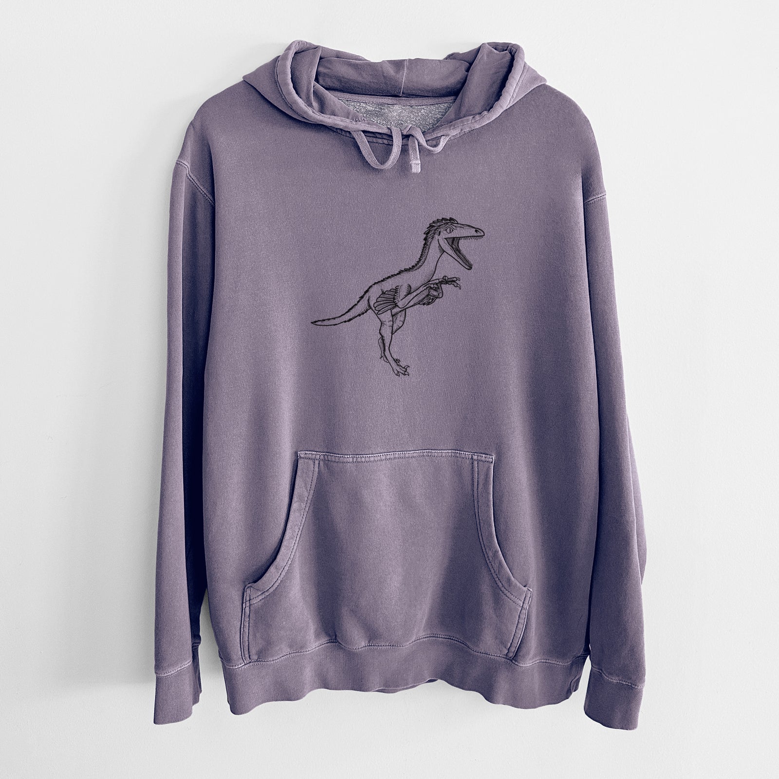 Plum purple pigment dyed hoodie laid flat, printed with a black ink illustration of a Troodon dinosaur running.