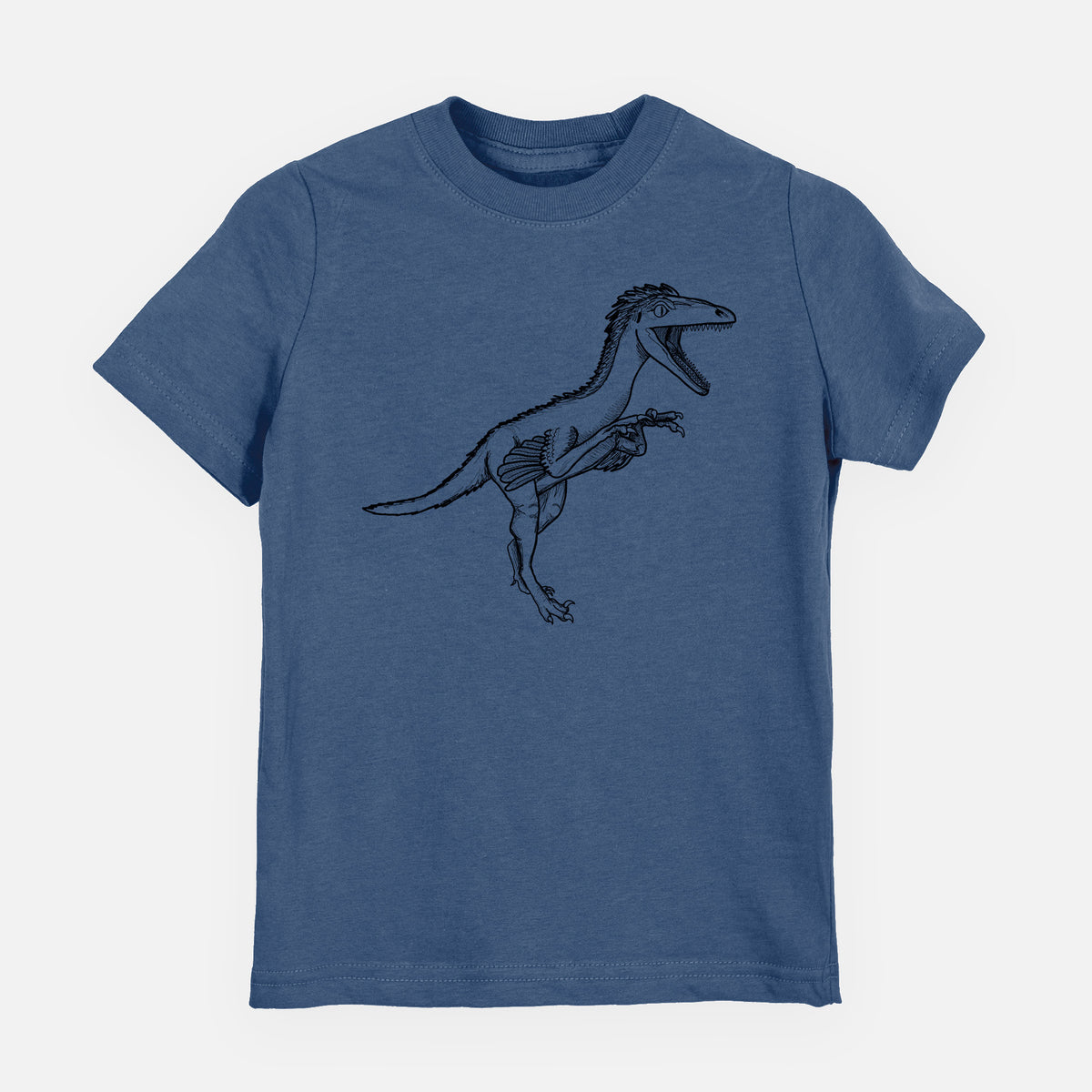 Indigo blue youth t-shirt laid flat, printed with a black ink illustration of a Troodon dinosaur running.