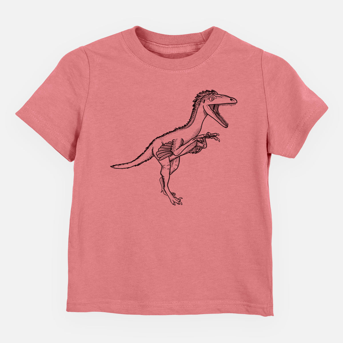Mauve pink toddler t-shirt laid flat, printed with a black ink illustration of a Troodon dinosaur running.