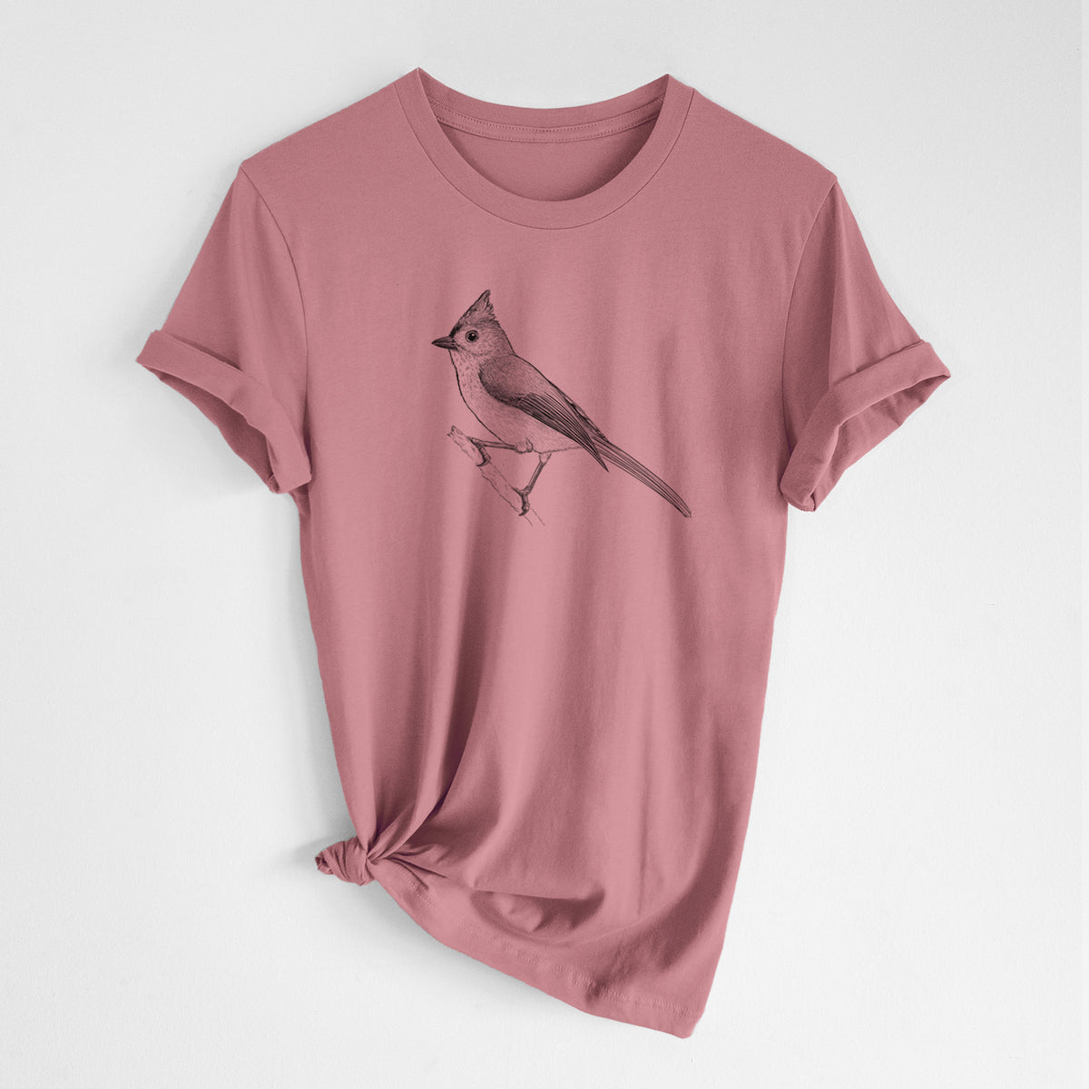 Mauve pink lightweight cotton t-shirt laid flat with the sleeves rolled, printed with a detailed black ink sketch of a tufted titmouse perched on a branch.