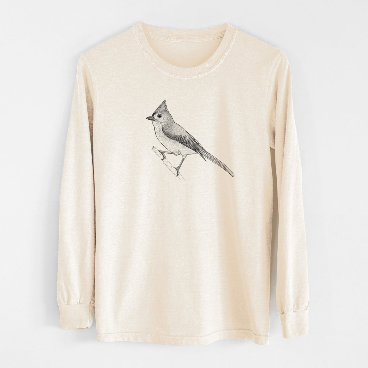 Ivory Comfort Colors long sleeve shirt laid flat, printed with a detailed black ink sketch of a tufted titmouse perched on a branch.