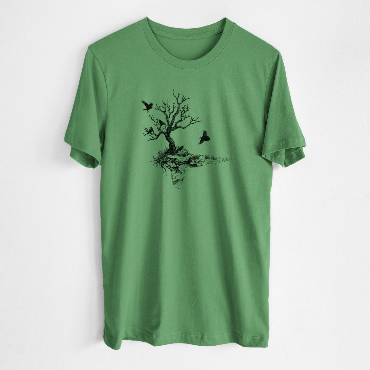 Leaf green lightweight cotton t-shirt laid flat, printed with a black ink illustration of a bare twisted tree on a small island with ravens flying around it.