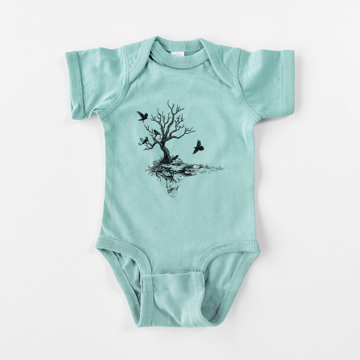Saltwater baby bodysuit laid flat, printed with a black ink illustration of a bare twisted tree on a small island with ravens flying around it.