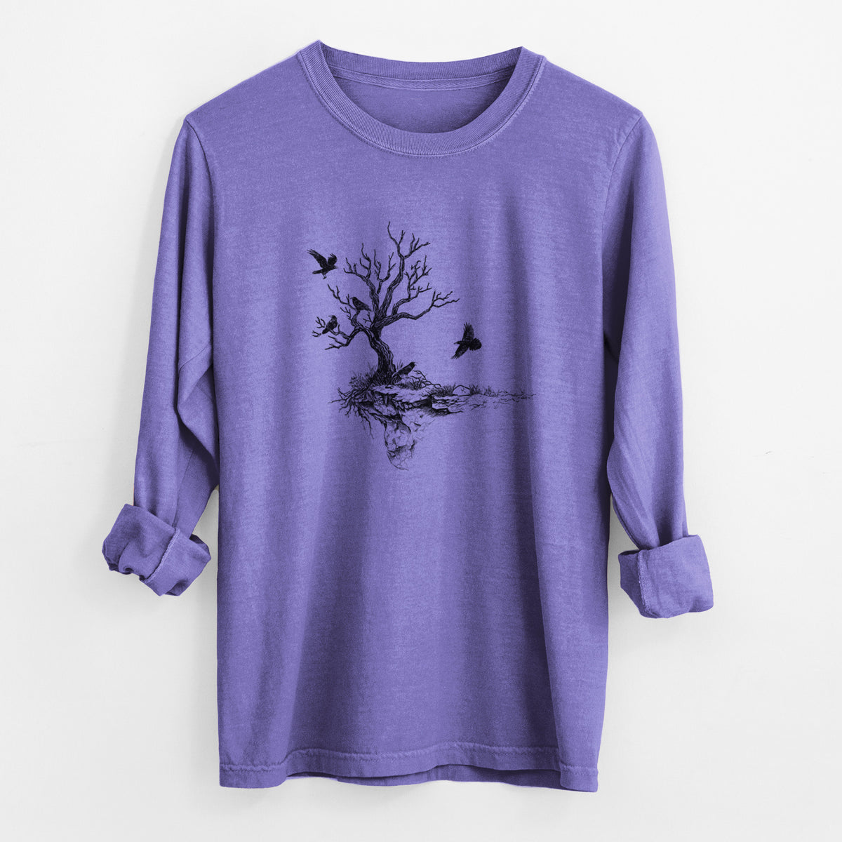 Violet purple Comfort Colors long sleeve shirt laid flat with the cuffs rolled, printed with a black ink illustration of a bare twisted tree on a small island with ravens flying around it.