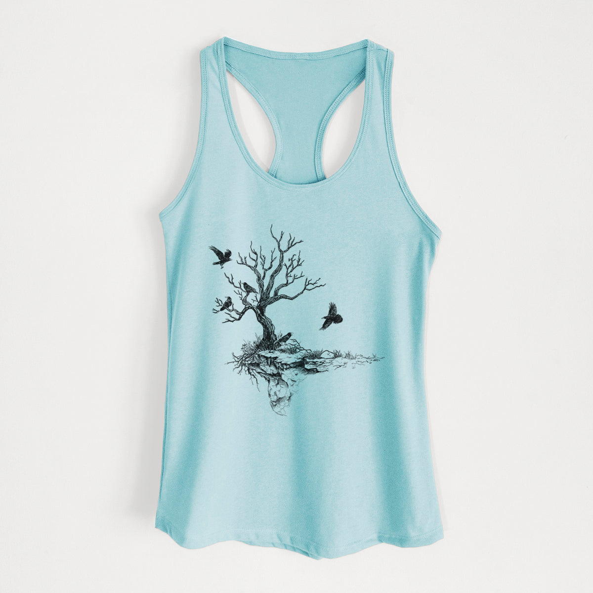 Cancun blue women's racerback tank top laid flat, printed with a black ink illustration of a bare twisted tree on a small island with ravens flying around it.