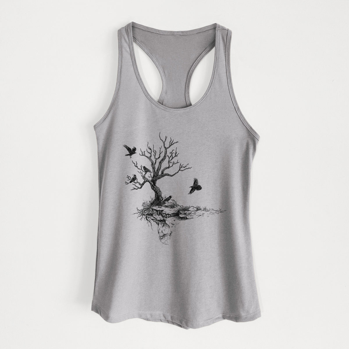Heather grey women's racerback tank top laid flat, printed with a black ink illustration of a bare twisted tree on a small island with ravens flying around it.