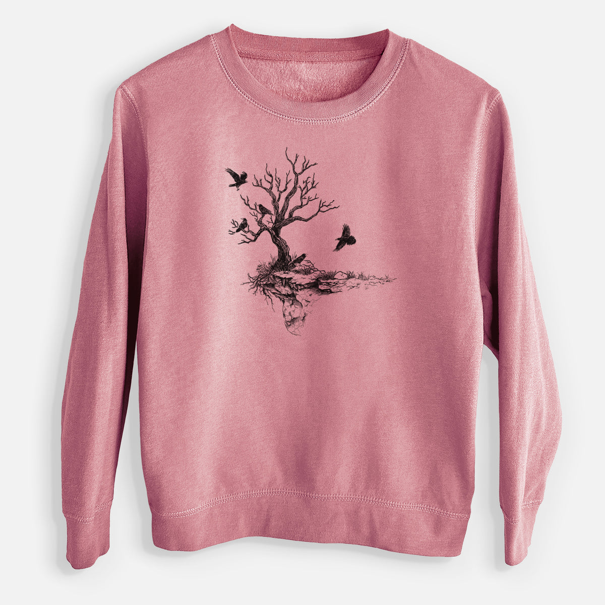 Mauve pink youth crewneck sweatshirt laid flat, printed with a black ink illustration of a bare twisted tree on a small island with ravens flying around it.