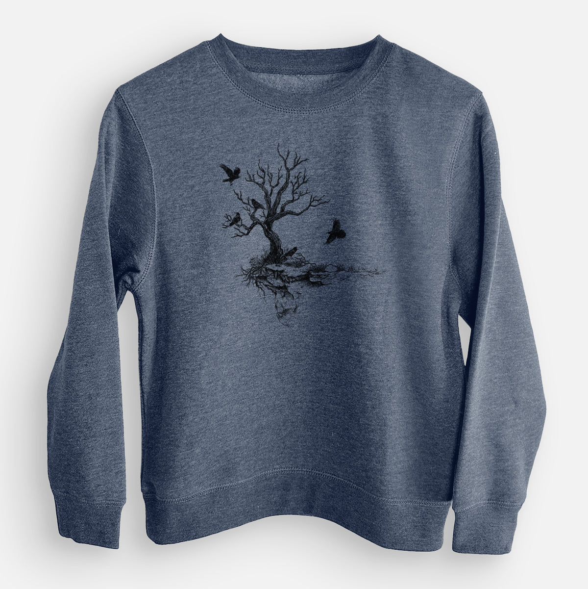 Storm blue youth crewneck sweatshirt laid flat, printed with a black ink illustration of a bare twisted tree on a small island with ravens flying around it.