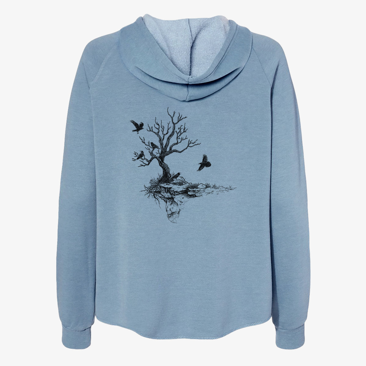 Misty blue women's Cali Wave zip-up sweatshirt laid flat, printed with a black ink illustration of a bare twisted tree on a small island with ravens flying around it.