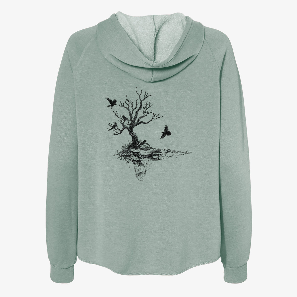 Sage green women's Cali Wave zip-up sweatshirt laid flat, printed with a black ink illustration of a bare twisted tree on a small island with ravens flying around it.