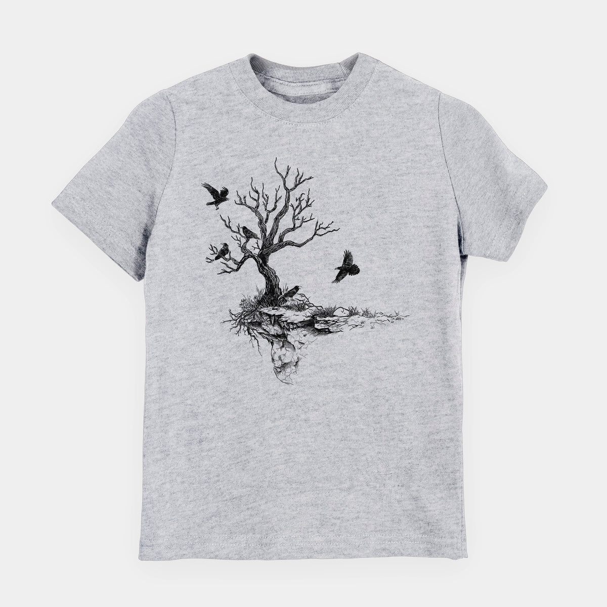 Heather grey youth t-shirt laid flat, printed with a black ink illustration of a bare twisted tree on a small island with ravens flying around it.
