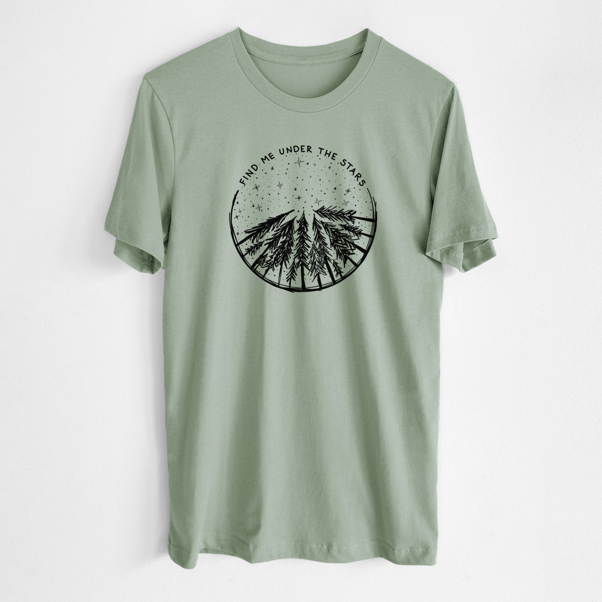 Sage green lightweight cotton t-shirt laid flat, printed with a circle of pine trees under a starry sky, with the words Find Me Under the Stars.