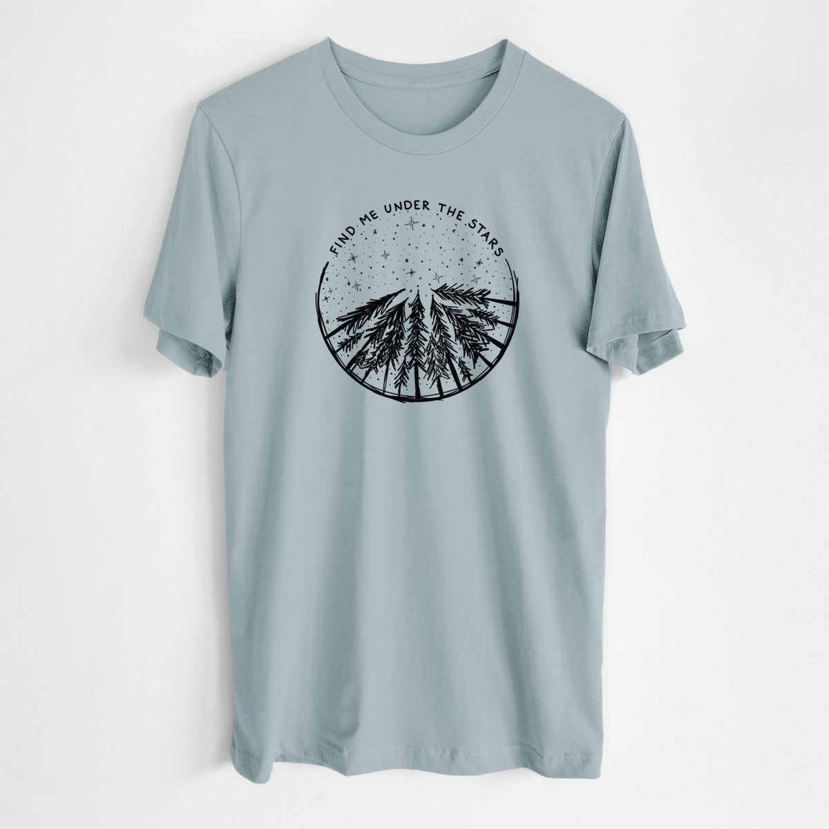 Vintage denim lightweight cotton t-shirt laid flat, printed with a circle of pine trees under a starry sky, with the words Find Me Under the Stars.