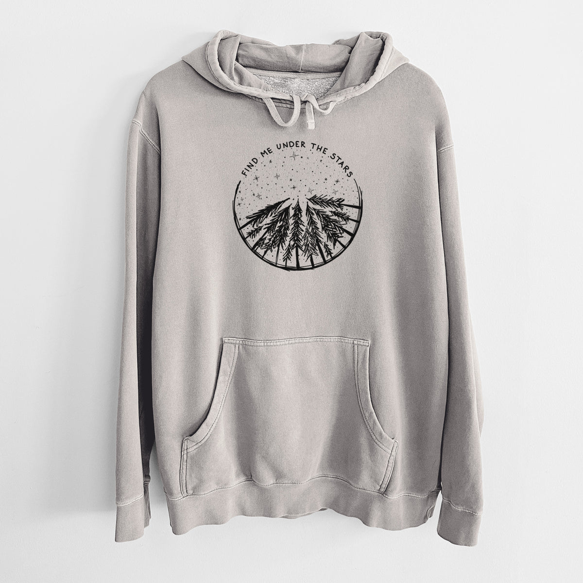 Cement grey pigment dyed hoodie laid flat, printed with a circle of pine trees under a starry sky, with the words Find Me Under the Stars.