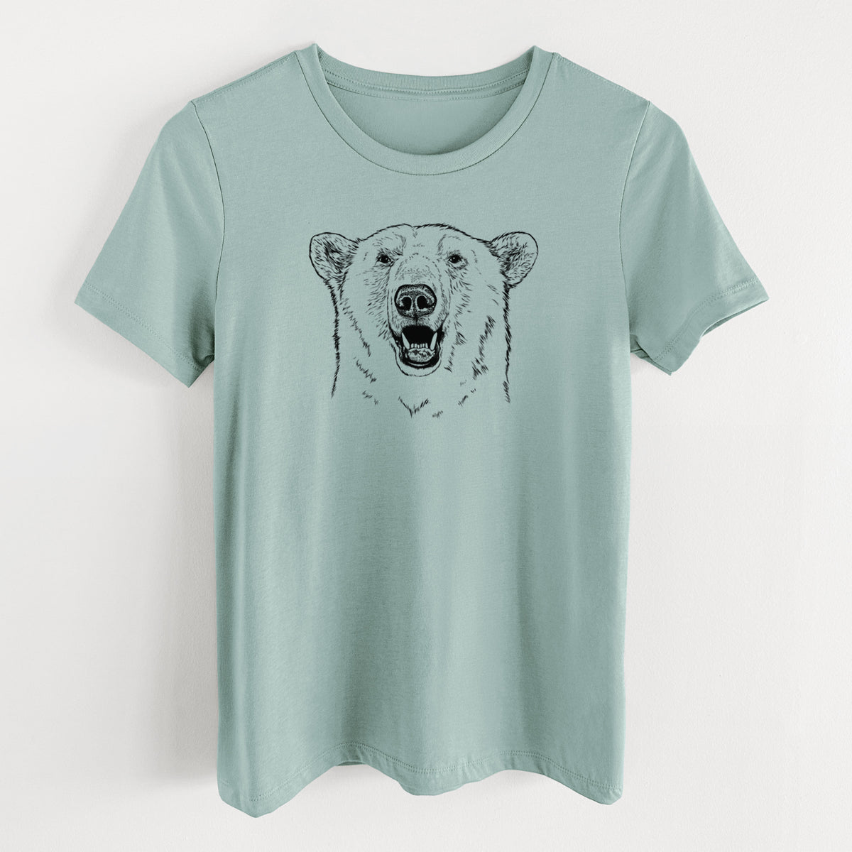 Dusty blue women's relaxed fit cotton t-shirt laid flat, printed with a black ink portrait of a smiling polar bear's face.