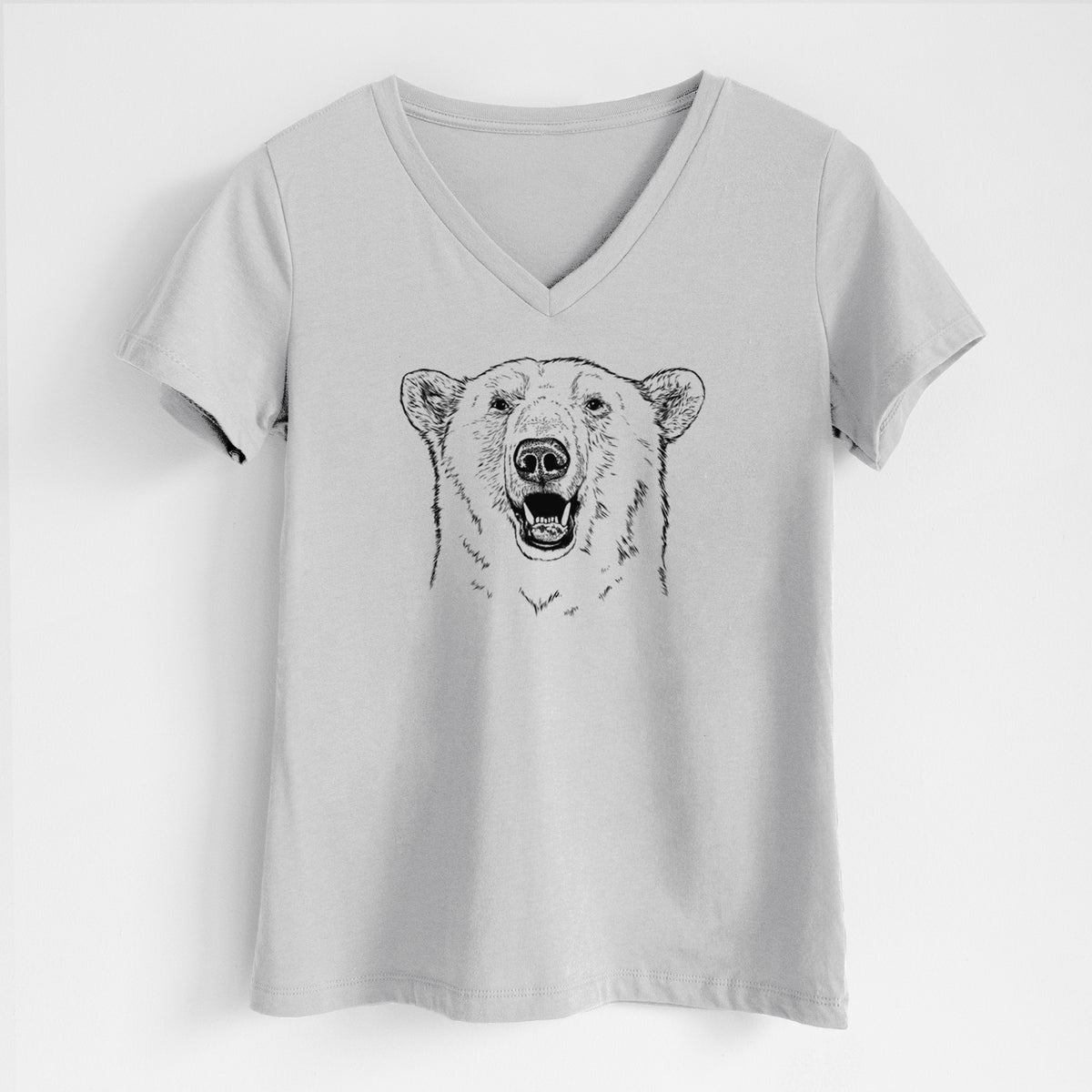 Lunar grey women's relaxed fit cotton V-neck t-shirt laid flat, printed with a black ink portrait of a smiling polar bear's face.
