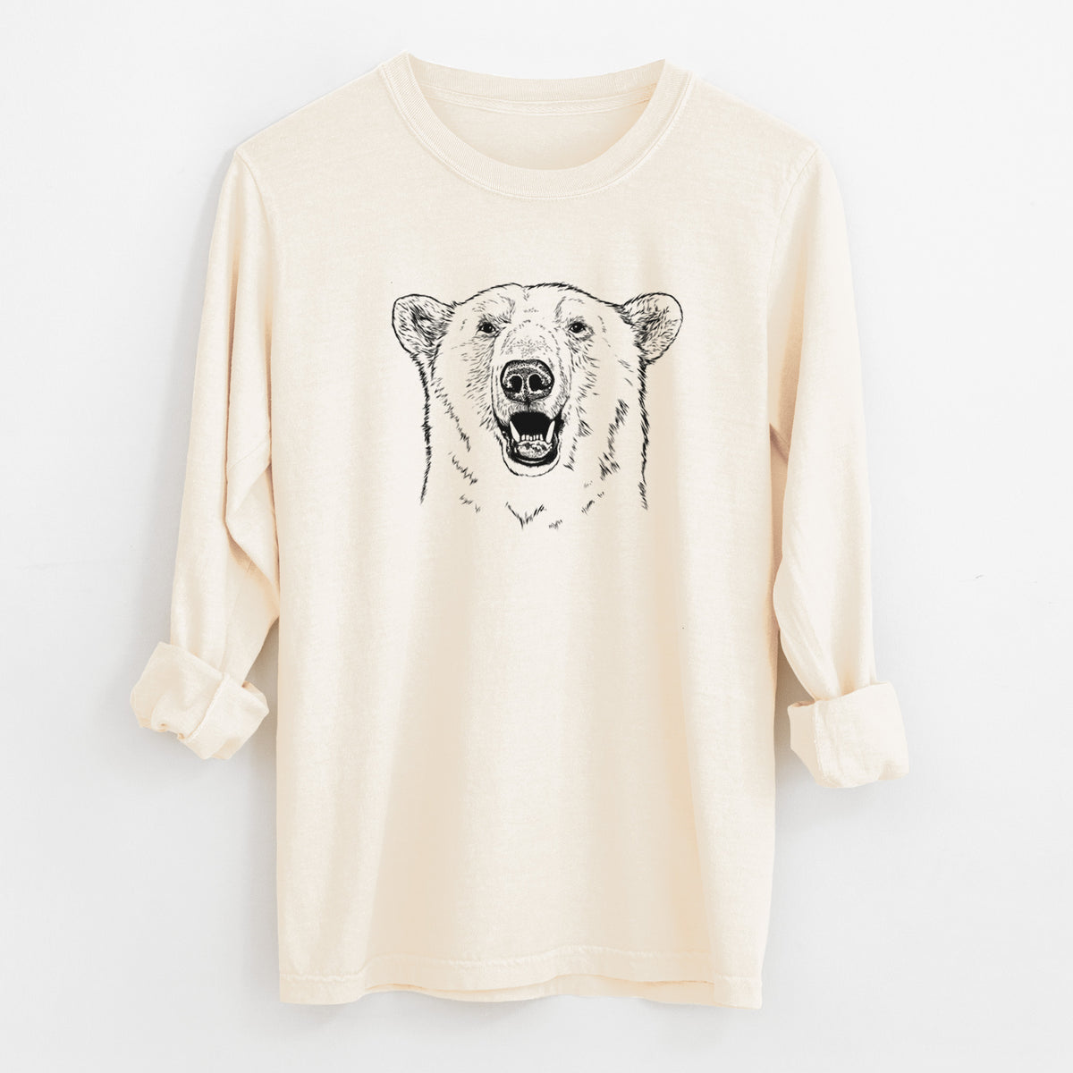 Ivory Comfort Colors long sleeve shirt laid flat with the cuffs rolled, printed with a black ink portrait of a smiling polar bear's face.