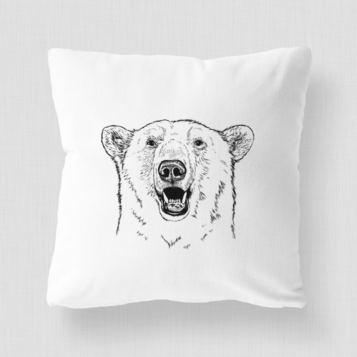 White pillow cover printed with a black ink portrait of a smiling polar bear's face.