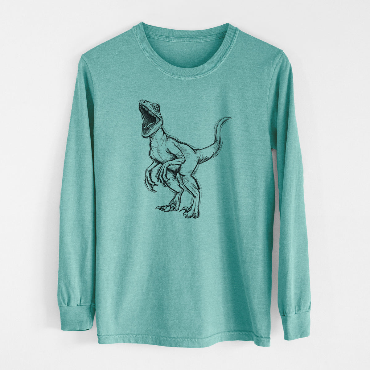 Reef green Comfort Colors long sleeve shirt laid flat, printed with a black ink illustration of a Velociraptor roaring.