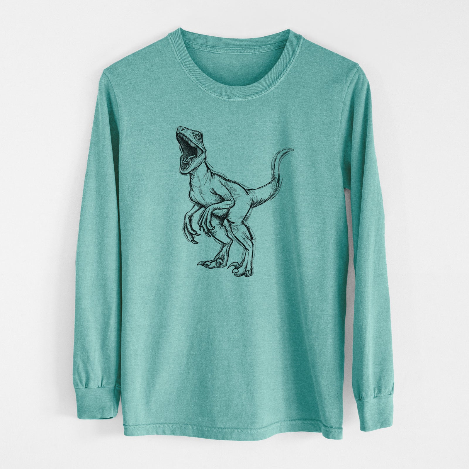Reef green Comfort Colors long sleeve shirt laid flat, printed with a black ink illustration of a Velociraptor roaring.