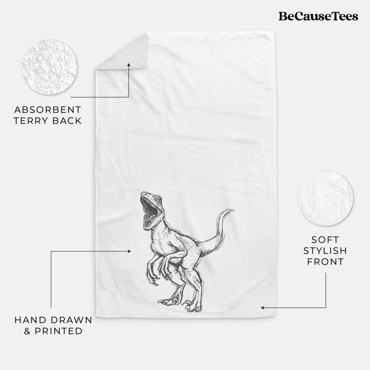 White hand towel printed with a black ink illustration of a Velociraptor roaring.