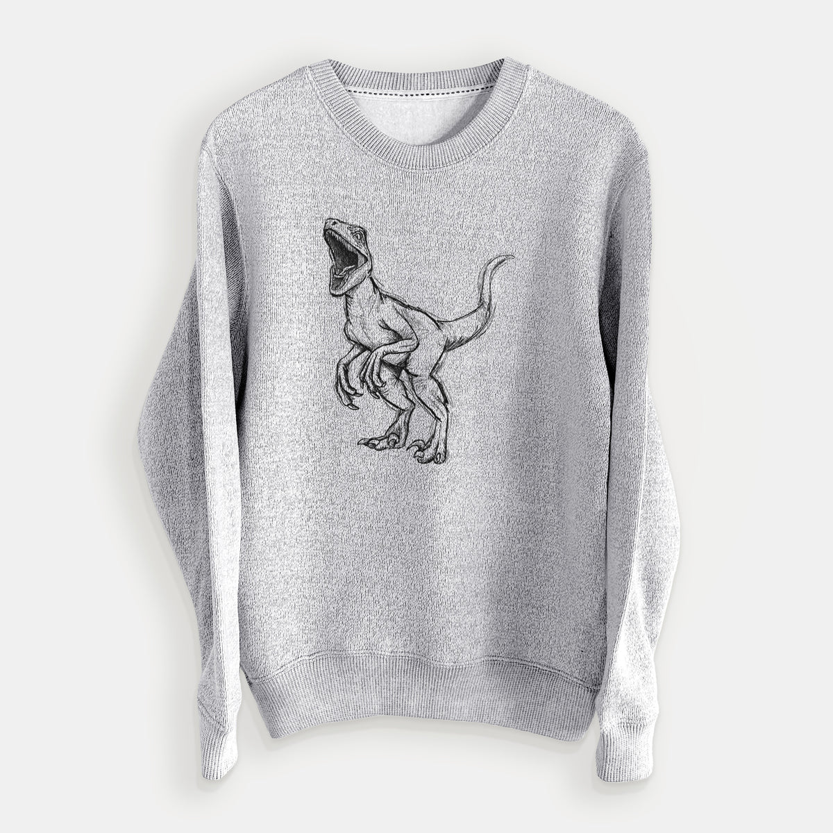 Salt and pepper knit sweatshirt laid flat, printed with a black ink illustration of a Velociraptor roaring.