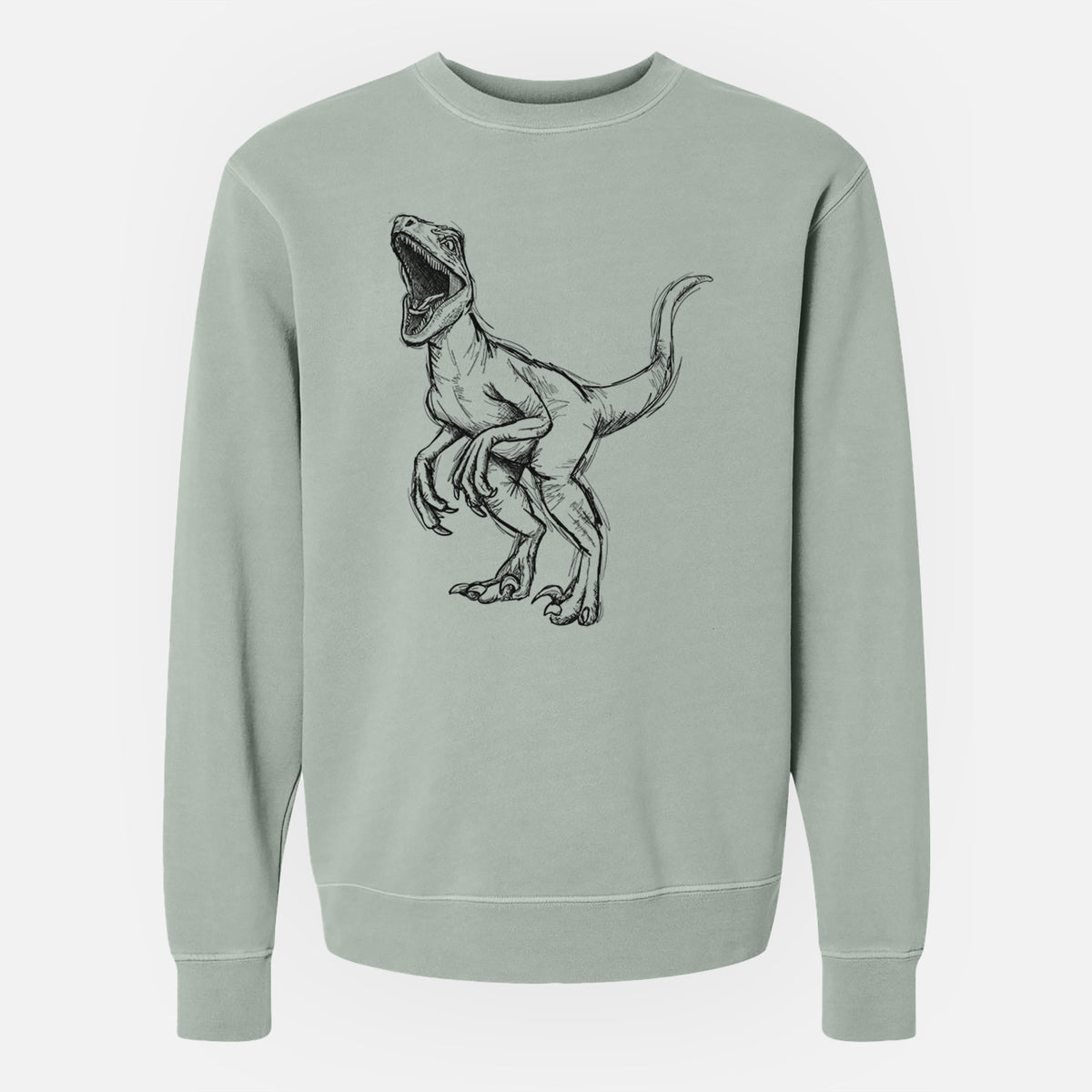 Sage green pigment dyed crewneck sweatshirt laid flat, printed with a black ink illustration of a Velociraptor roaring.