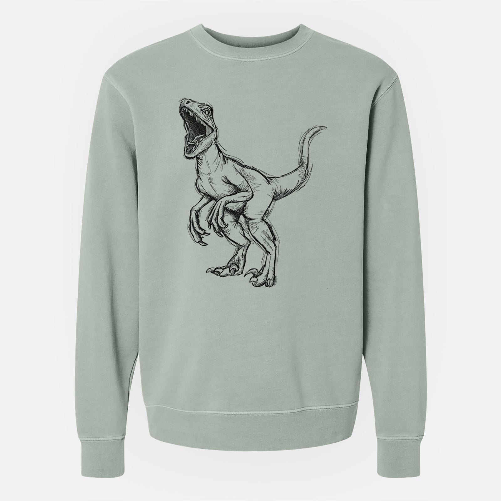 Sage green pigment dyed crewneck sweatshirt laid flat, printed with a black ink illustration of a Velociraptor roaring.