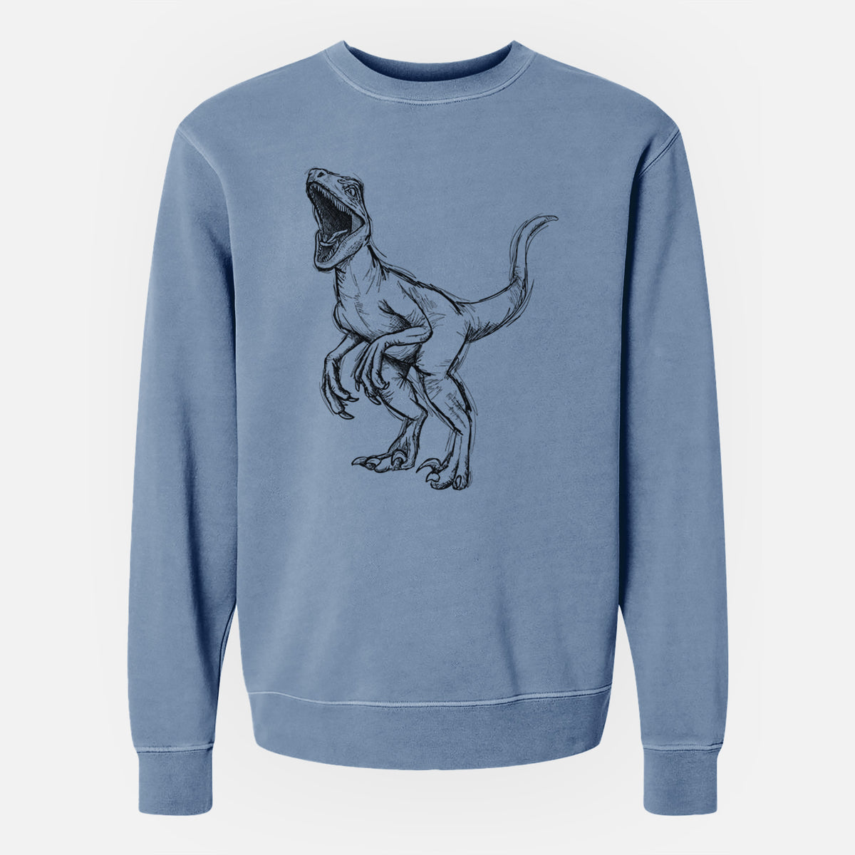 Slate blue pigment dyed crewneck sweatshirt laid flat, printed with a black ink illustration of a Velociraptor roaring.