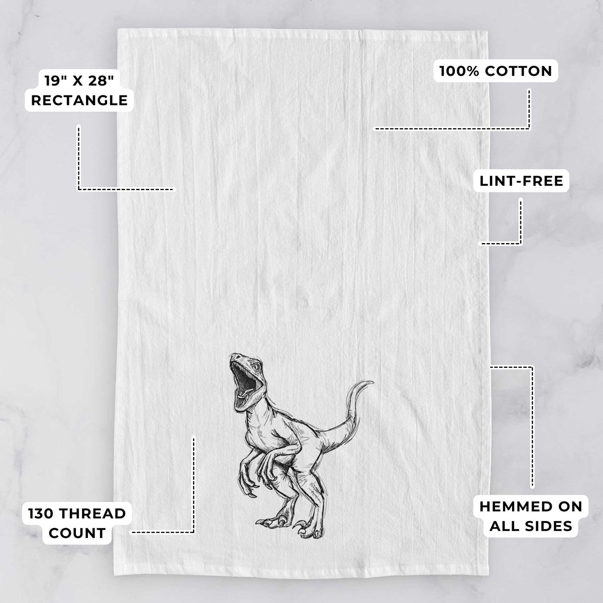 White tea towel printed with a black ink illustration of a Velociraptor roaring, with feature labels: 19 by 28 inch rectangle, 100% cotton, lint-free, 130 thread count, hemmed on all sides.