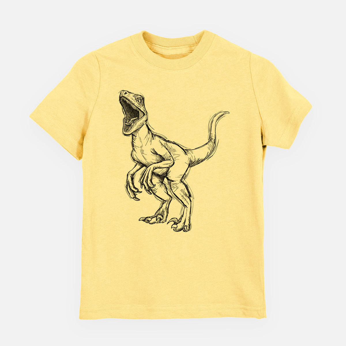 Butter yellow youth t-shirt laid flat, printed with a black ink illustration of a Velociraptor roaring.