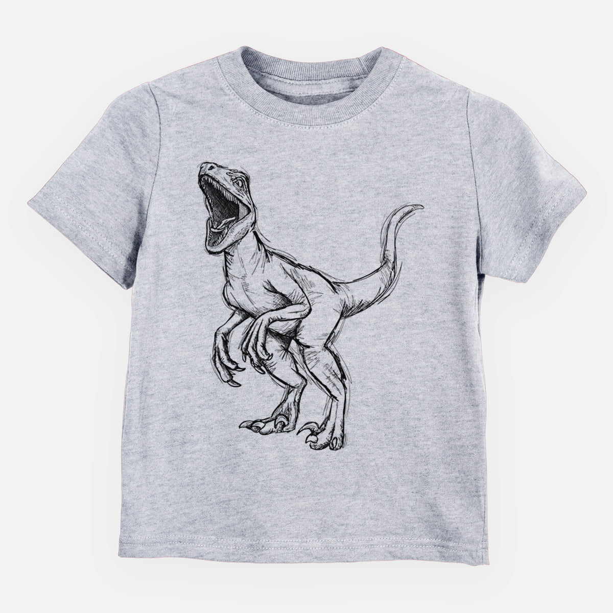 Heather grey toddler t-shirt laid flat, printed with a black ink illustration of a Velociraptor roaring.