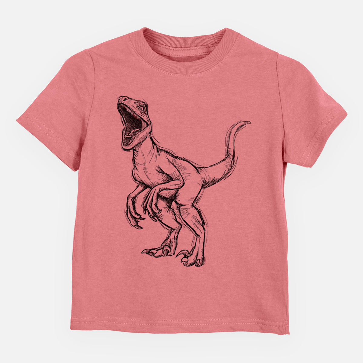 Mauve pink toddler t-shirt laid flat, printed with a black ink illustration of a Velociraptor roaring.