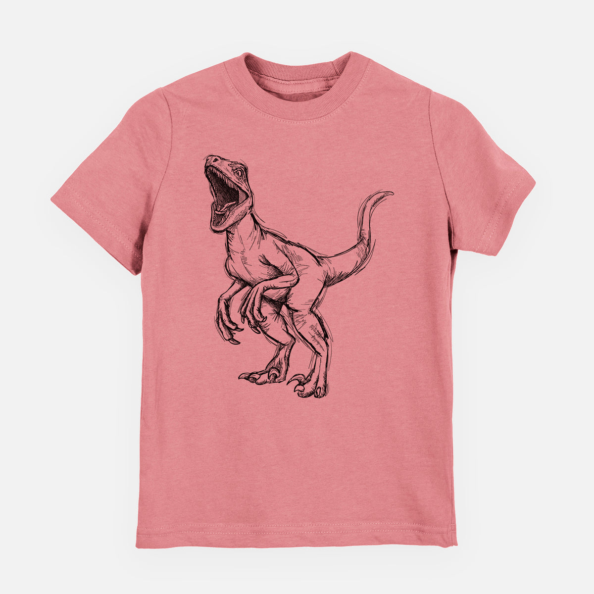 Mauve pink youth t-shirt laid flat, printed with a black ink illustration of a Velociraptor roaring.