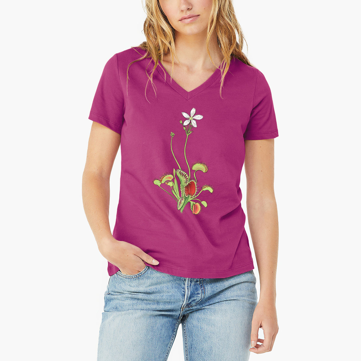 Woman wearing a berry pink women's relaxed fit cotton V-neck t-shirt printed with a full-color illustration of a Venus flytrap plant with red traps and a small white flower.