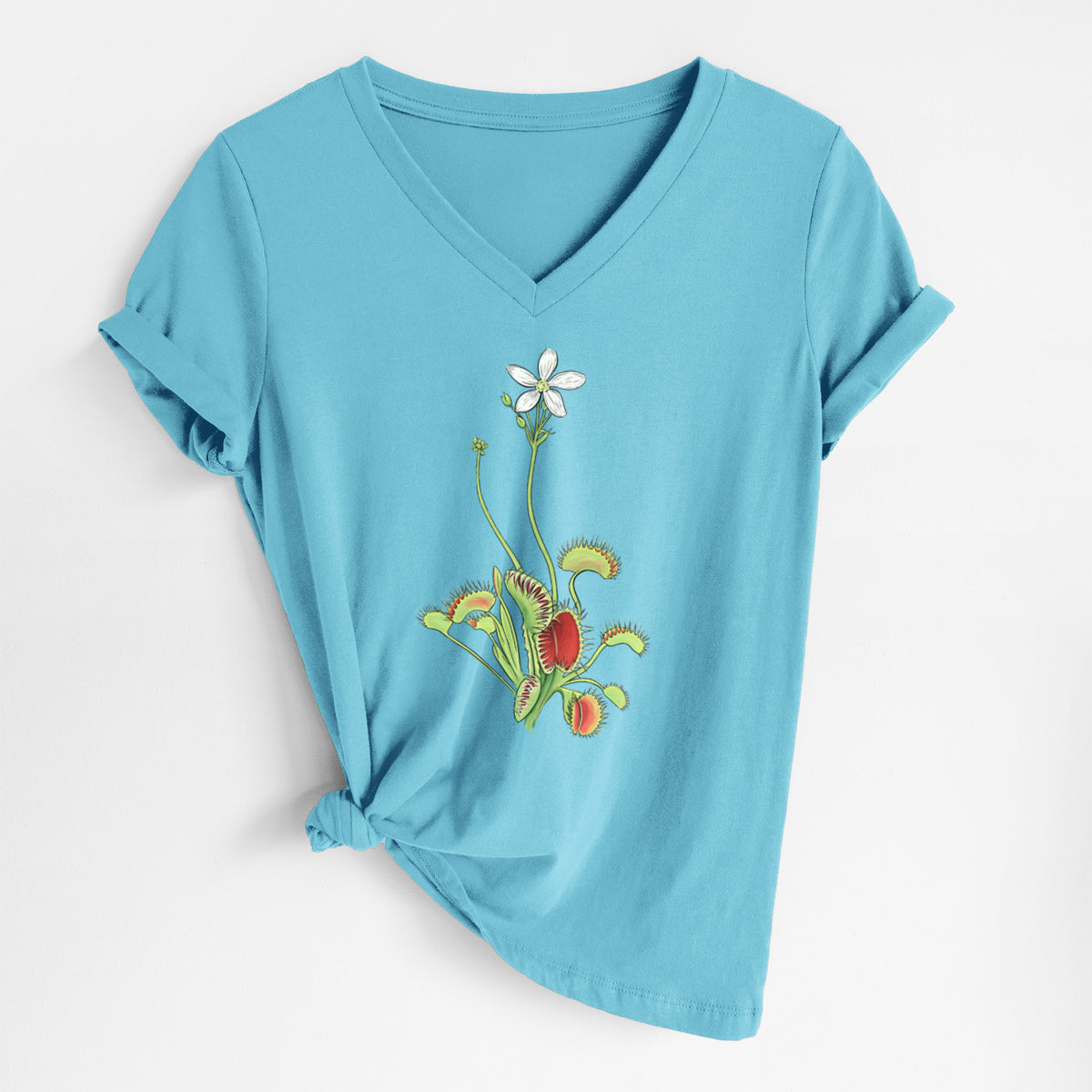 Turquoise women's relaxed fit cotton V-neck t-shirt laid flat, printed with a full-color illustration of a Venus flytrap plant with red traps and a small white flower.
