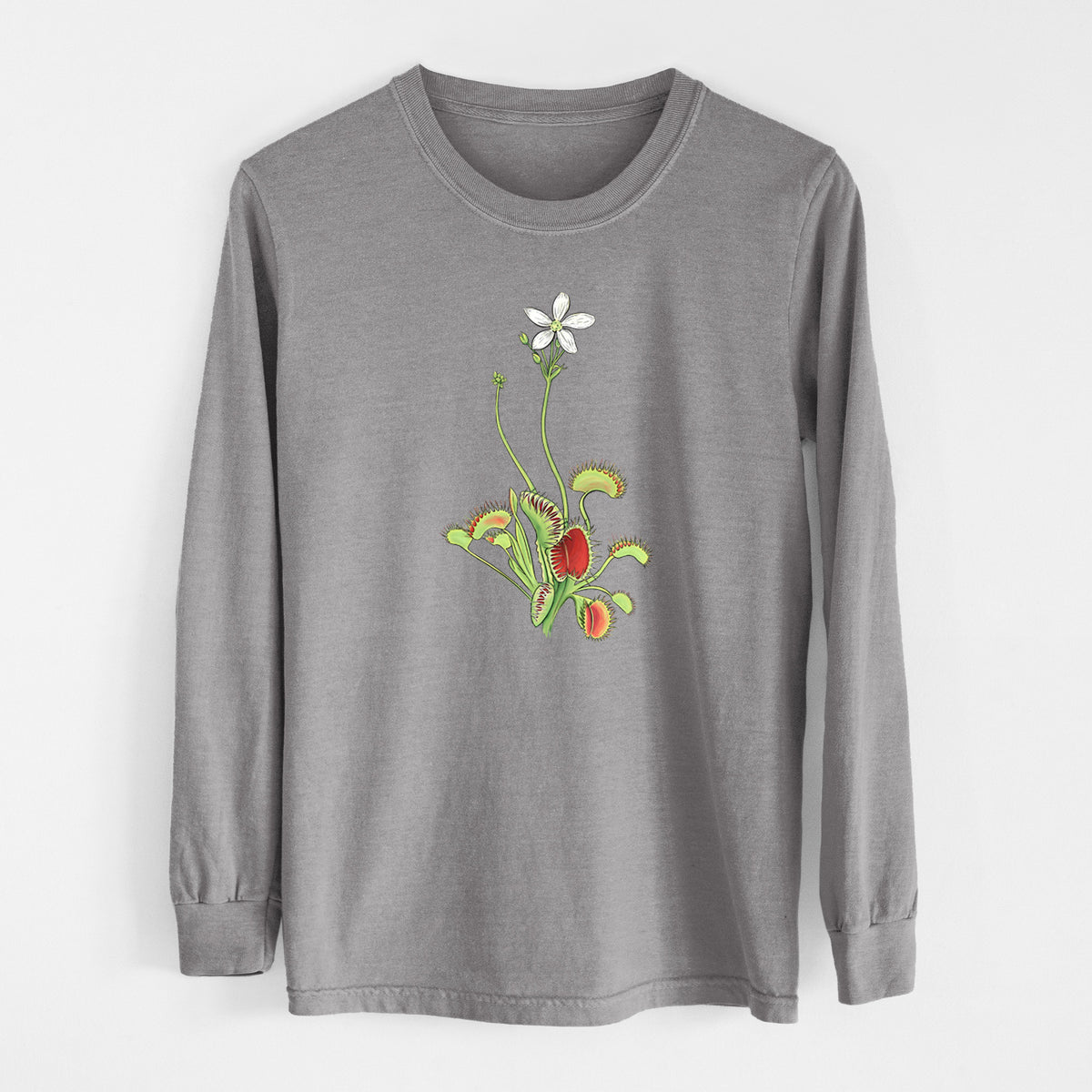 Grey Comfort Colors long sleeve shirt laid flat, printed with a full-color illustration of a Venus flytrap plant with red traps and a small white flower.