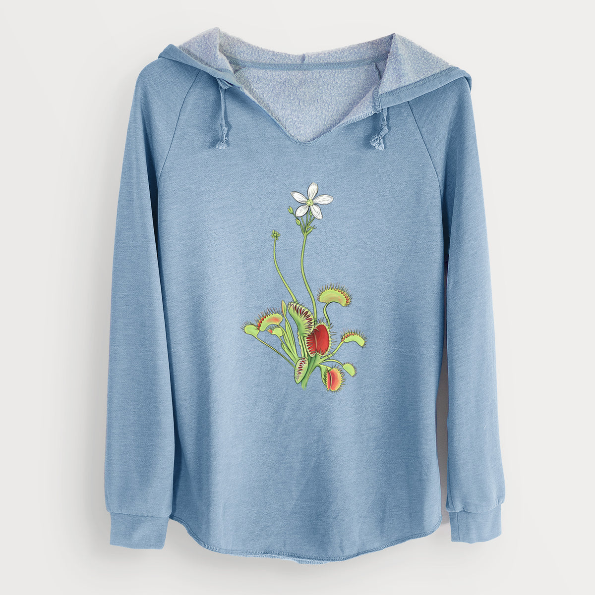 Misty blue women's Cali Wave hooded sweatshirt laid flat, printed with a full-color illustration of a Venus flytrap plant with red traps and a small white flower.