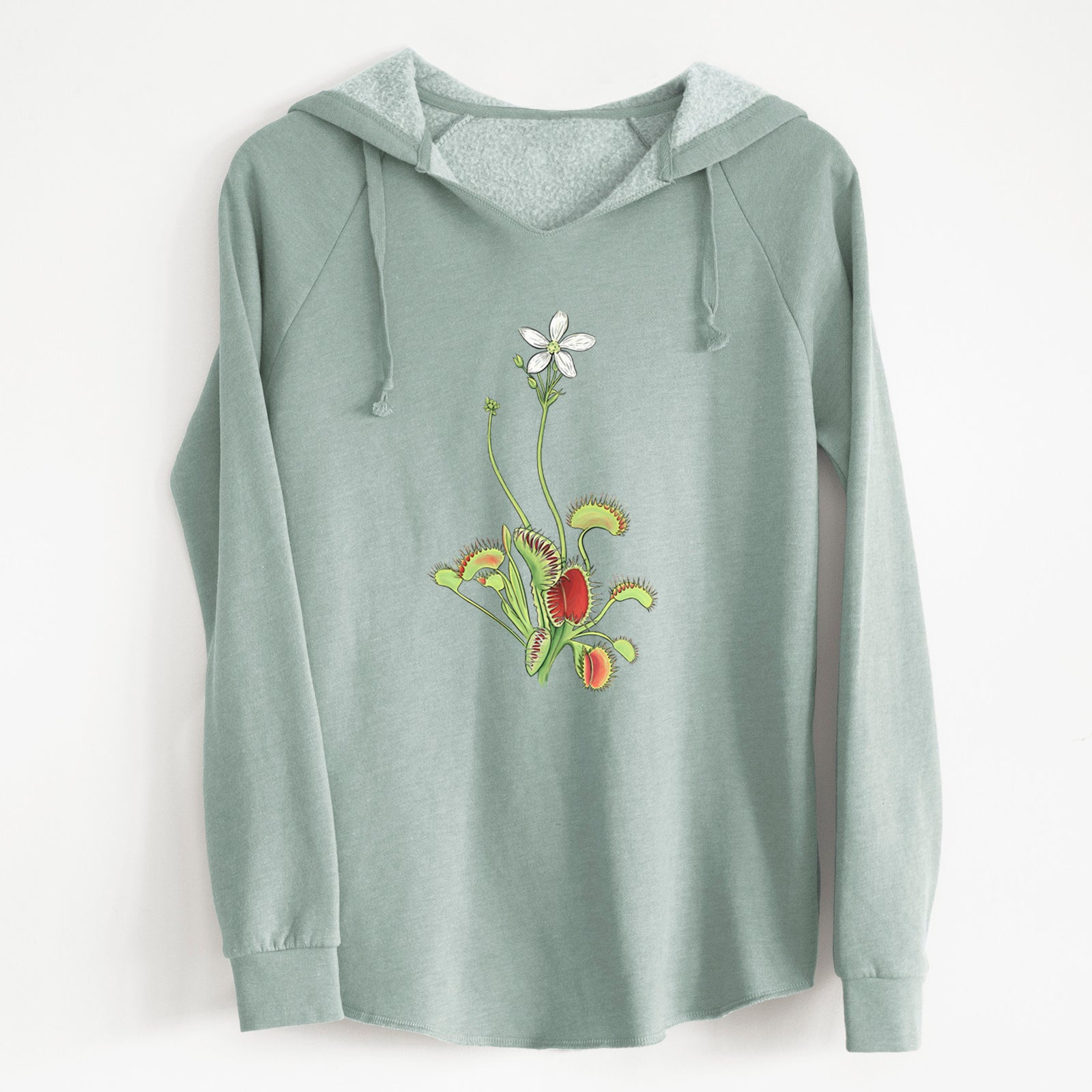 Sage green women's Cali Wave hooded sweatshirt laid flat, printed with a full-color illustration of a Venus flytrap plant with red traps and a small white flower.