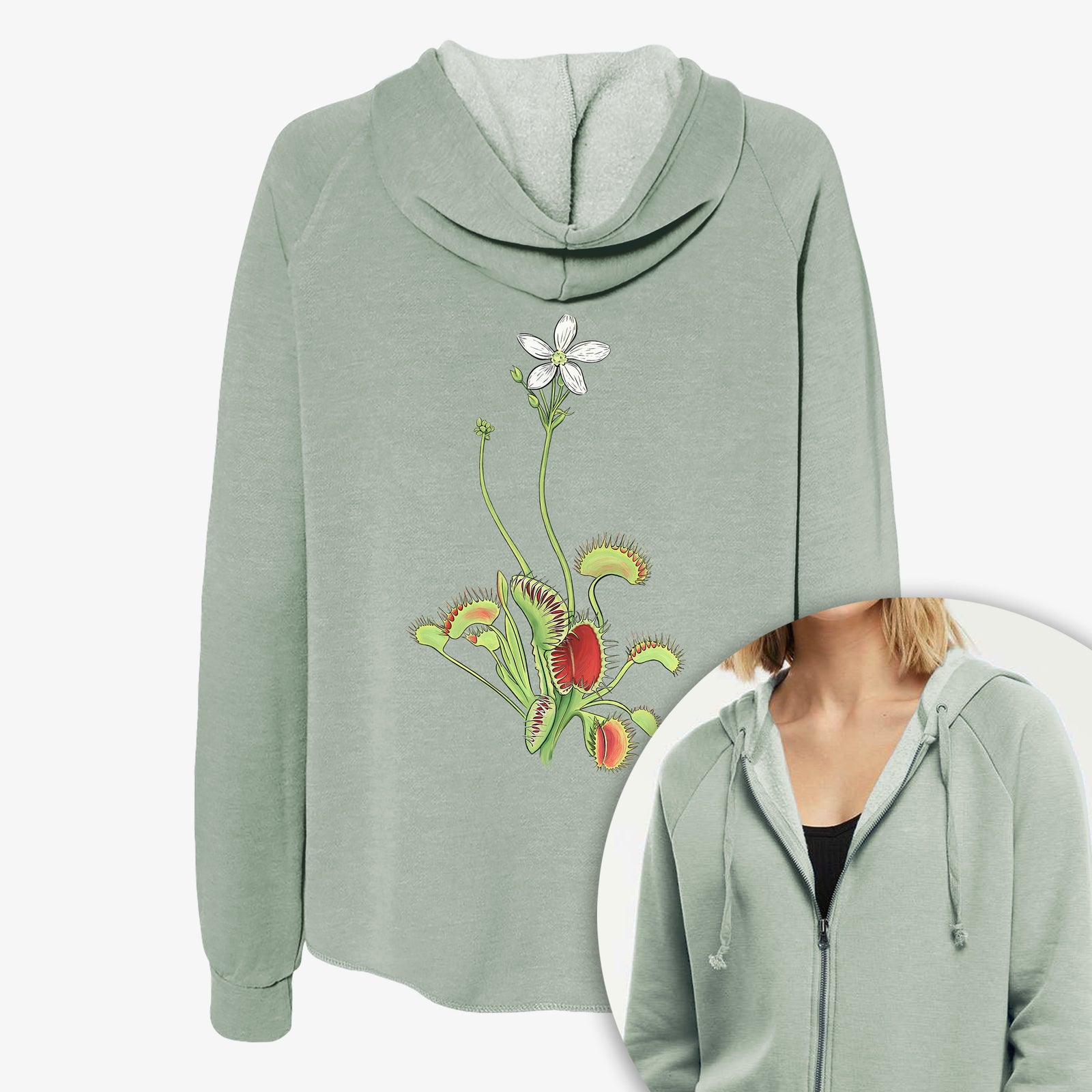 Women's Cali Wave zip-up sweatshirt printed with a full-color illustration of a Venus flytrap plant with red traps and a small white flower, with a close-up of the zipper.